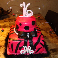 Sweet 16 Birthday Cake 10 inch square white 3 layer cake with pineapple filling, covered in hot pink fondant and black fondant zebra stripes. 6 inch round 2 layer...