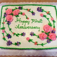 First Anniversary Half Sheet Cake Victorian Roses, Drop Flowers and Vines with Leaves adorn this 1st Anniversary Half Sheet Cake.