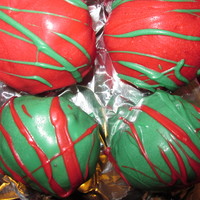 Christmas Cake Balls Red velvet cake with cream cheese frosting, glazed with white chocolate candies colored, drizzled with white chocolate candies colored too...