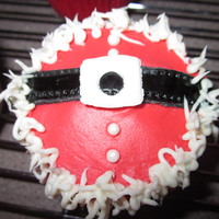 Santa Belly Strawberry cake dyed red, strawberry buttercream dyed, fondant belt, edible balls and vanilla buttercream rim!