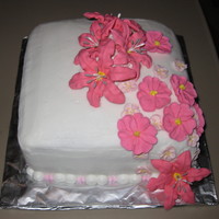 Pink Flowers Final cake for my Flowers and Cake Decorating wilton class. Hard to tell in the photo but it's three different shades of pink.