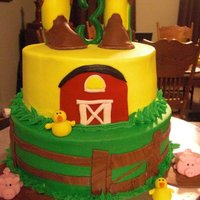 John Deere Cake 2 tier cake covered in buttercream, fondant details, fondant boots