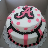 Alabama Alabama College pink , black , and white with polka dots and stripes butter cream with mm fondant decorations