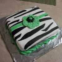 Pretty Zebra zebra with green ribbon and green and black flower