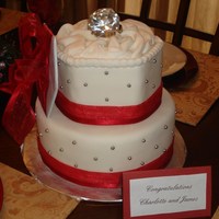Engagement Ring Cake Cake was made with a 10 inch round base and a hand cut hexagon that was about 6.5 inches wide. The cake was covered in MMF and decorated...