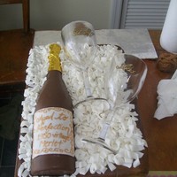 60Th Birthday My first time with painting wood grain and also my first time writing luster dust. Fondant with chocolate bottle and plastic wine glasses...