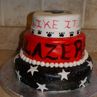 Dance Stars Cake for a school dance team banquet. Layers have their songs displayed on them sprinkled with edible glitter