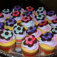 Flower Fun Vanilla cupcakes, multicolored vanilla buttercream icing with chocolate and fondant flowers