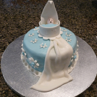 Baby Shower fondant cake with gumpaste baby and blanket.