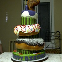 Donut Cake donuts made out of cake covered with marshmallow fondant.....porkchop made out of krispy cereal(that's his favorite meat)