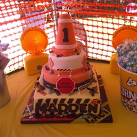 Construction Cake chocolate and vanilla cake covered with marshmallow fondant. cone made out fo rice krispy cereal treat.
