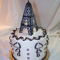 Eiffel Tower Gluten free lemon cake. Gumpaste and RI used for the tower. Fondant accents cut with Stephen Benison cutters. LOVE his line!
