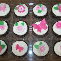 Flowers And Butterflies Gluten and dairy free choc. cupcakes with vanilla bean buttercream. Fondant accents brushed with pearl dust.