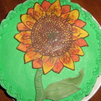 Sunflower This cake was made for a small get together. The sunflower is chocolate. The leaves and stem are gum paste. Really simple and pretty.