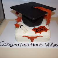 University Of Texas Graduation Cake 2010 Iced in buttercream with fondant decorations. I used a clay extruder for the tassel and the top of the cap is cardboard covered with...