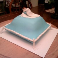 My First Pillow Cake This is my first time baking a "fancy" cake...I had a leftover blue baby boy from my own son's Baptism and decided since it...
