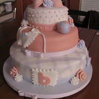 First Baby Shower Cake I made this cake for a friend of a friend. This was her gift to the mom to be. This was my first tiered cake as well. Everything is edible...