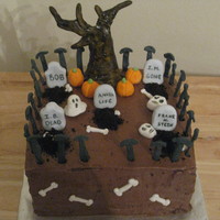 Spooky Graveyard Chocolate cake with mousse filling. Figures are all made of gumpaste and tree is painted. TFL!