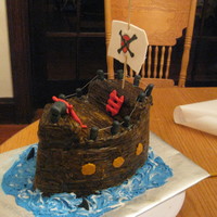 Pirate Ship This was for my nephew. It also had backyardigans figures on it that I made out of gumpaste. Cake is covered in fondant "wood planks&...