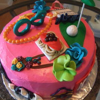 Personilty Cake This is a cake I made for a 60th Birthday. The cake highlights all the things the birthday girl likes.