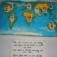World Map Cake For International Day hand painted multi- cultural figures