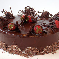 Triple Chocolate And Strawberry Chocolate mud cake filled with chocolate buttercream, iced in chocolate ganache, chocolate covered strawberries..