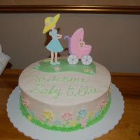 Ride With Pride Baby Shower Cake Cake is vanilla with vanilla buttercream. Flowers are fondant, leaves and stems were piped in buttercream. "Grass" on top of cake...