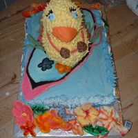 Duckcake.jpg fondant surfboard, flowers and shells. regular white cake mix for cakes. Used wilton duck mold for duck.