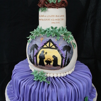 Christmas Cake This is a fondant covered cake with a gumpaste crown of thorns and gumpaste ivy and holly leaves. The middle layer was inspired by...