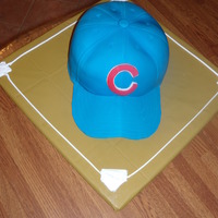 Cubs Hat Cake Made this for my hubby's birthday. My first attempt at a 3d cake. Followed "Confetti Cakes" instructions but personalized it...
