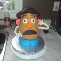 Mr. Potatoe Head this is my Mr. Potaoe head... He is 3D and I made all of his pieces from gumpaste and attatched them to the flower making nail thingys (not...