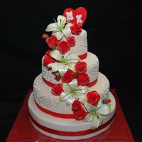 Lilies And Roses This is a 3 tiered cake Vanilla Cake with bavarian cream, Chocolate cake with Strawberries and cream and Vanilla Cake with Dulce de leche....