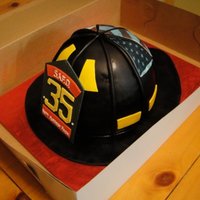 Firefighter Helmet A birthday cake for a firefighter. Fondant and gumpaste decorations. Also used an edible image for the American flag on the back of the...
