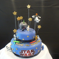 Star Wars Lego figuresplaces around fondant death star ( styrofoam ball covered in fondant) Fondant stars,edible glitter or luster dust.