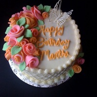 Pink And Apricot Roses With A White Chocolate Butterfly This is a white cake with buttercream filling (no flavors but thats what the client wanted) with fondant roses, lattice sides, and a white...