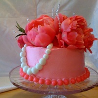 Pink Peonie Cake This is a cake I made for a womens brithday The white strand is a pearl necklace. It's zebra inside!!!