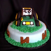 John Deere 2Nd Birthday Cake I made this cake for a 2nd birthday. It is chocolate cake with chocolate buttercream with a combination of homeade fondant (not mmf), MMF,...