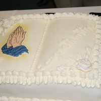 8Th Grade Confirmation This is a bible with the hands of God. It was made with buttercream icing and fondant.