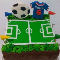 Soccer Ball With Jersey Chocoalte Fudge Cake with buttercream frosting and decors all made from fondants.