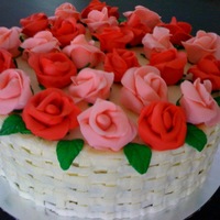 Basket Of Roses Basket woven using buttercream, and roses are made from fondant.