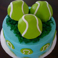 Tennis Lover Birthday Cake Cake is carrot cake, the balls are made using the Wilton Mini ball mould and it is chocolate cake.