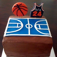Basketball Cake chocolate cake topped with buttercream frosting. The decors are all fondants.