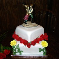Skull Wars Wedding cake for people that like skeletons and Star Wars. Gumpaste/Choc. Modeling clay yellow roses and real red roses. Sorry it's a...
