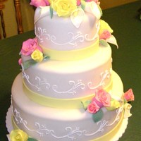 Pink And Yellow Roses Wedding cake with gumpaste/modeling clay roses and calla lillies.