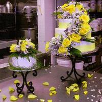 Yellow Roses A 3 tiered round cake with a separate cake for the bride and groom. I put together all the flowers to cascade down the cake as well.