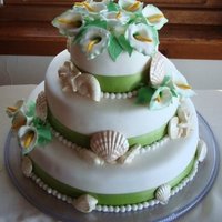 Calla Lilies And Sea Shells Gum paste Calla Lilies, white chocolate shells, fondant balls. My first-ever attempt at calla lilies, no time to practice with only one...