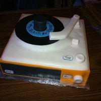 Retro Record Player I saw this cake here on CC and I had to make it for my brother in law. He loved it! The arm swiveled and the record was not attatched.