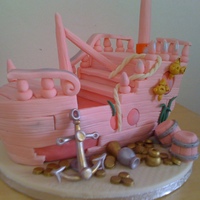 Pirate Ship made this for my daughters 14th........ not exactly a girls cake but the colour certainly turned it into one..... its not just a mans world...