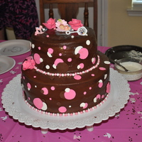 Brown & Pink Babyshower Cake 2 tier brown and pink themed baby shower cake, with fondant roses and pearls. pastillage baby, chocolate/ white chocolate /pink colored...