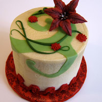 Red Lily Cake Funfetti with golden buttercream icing. I mixed gold sheen and pearl sheen Americolor airbrush colors to get a light gold color. Lily is...